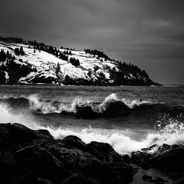 Monochrome Majesty Waves Rocks and Snow