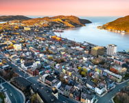 Golden Hour Aerial View of St. Johns Harbour and Colorful Row Houses