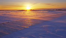 winter sunset over Western Brook Pond trail