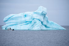 Natures frozen giant meets mans quiet journey on the sea