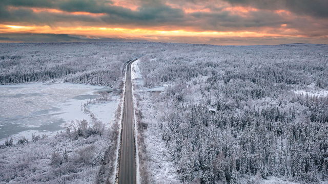Fresh Snow at Jonathans Pond During a Fiery Winter Sunset Newfoundland Print