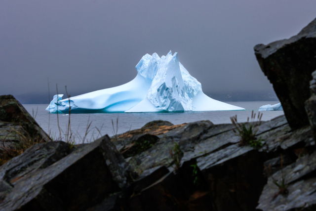 Iceberg Framed In A Rock