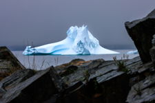 Iceberg Framed In A Rock