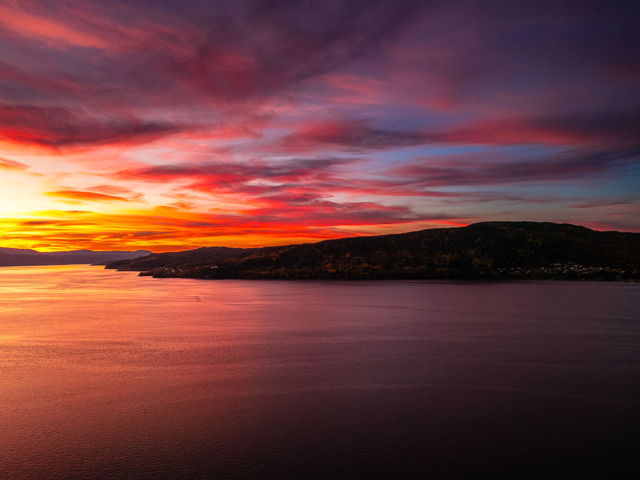 Fiery Sunset Over Tranquil Waters